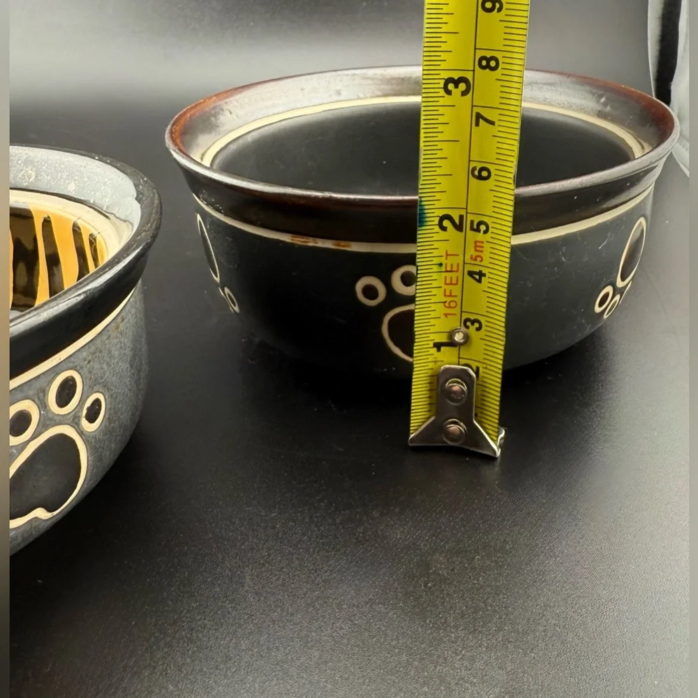 2 small dog dishes. Chic tiger print and bone print. 5”